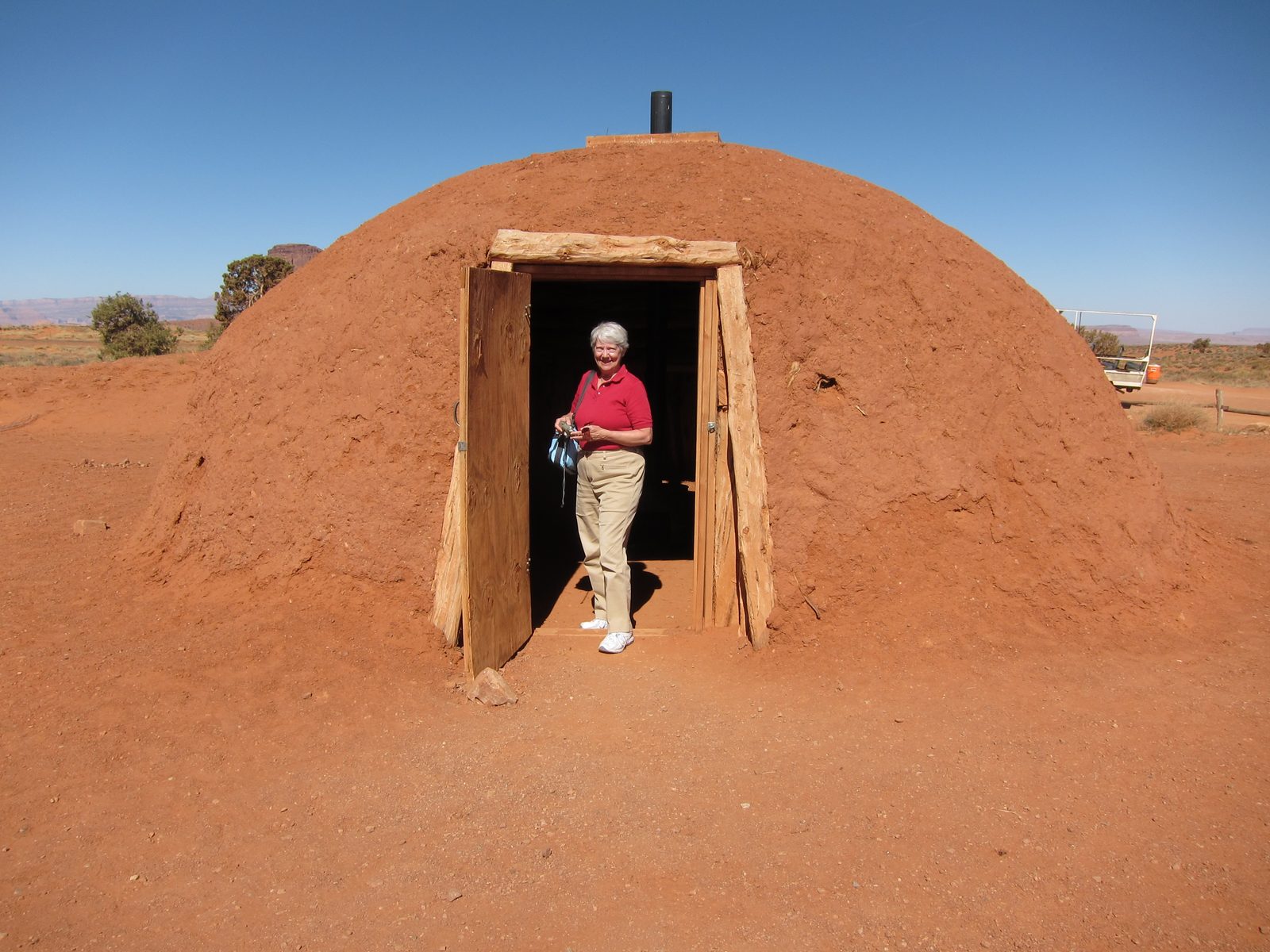 The outside of the hogan, packed with adobe